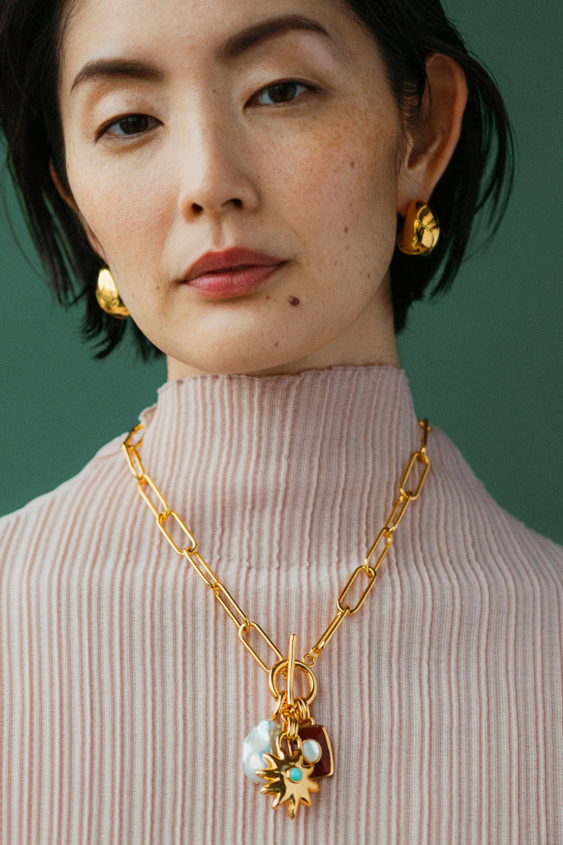 HELIOS CHARM NECKLACE IN SEA